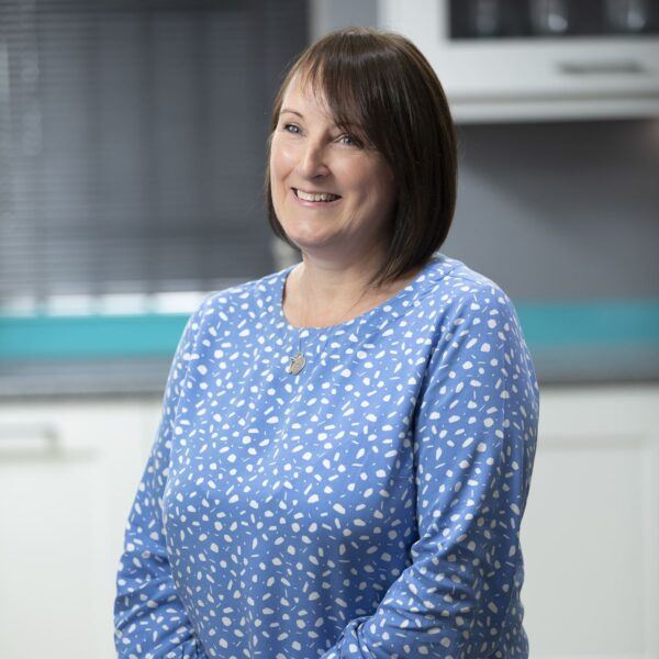 Ashington Showroom Kitchen Planning Specialist Deborah in a blue shirt