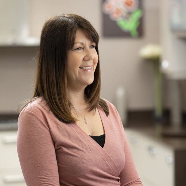 Cavendish Kitchens Sales Director, Jackie, smiling in a pink shirt