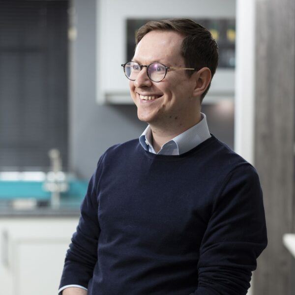 Mark, Bespoke Kitchen and Furniture Planner, Wearing Blue Shirt and Navy Jumper, Smiling, Part of Cavendish Kitchens Team