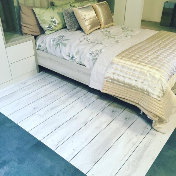 Modern Bedroom with White Wooden Slatted Flooring, Custom Furniture in White and Grey, Floral Green and Pink Satin Bedding on Bed
