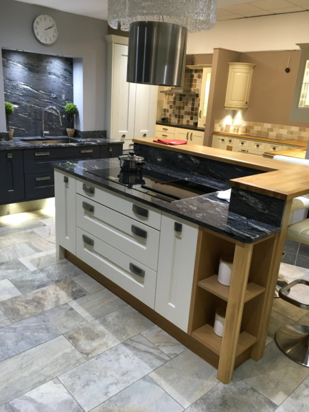 Cavendish Kitchen Showroom Island with Storage Underneath, Integrated Double Hob, White Cabinet Drawers, and an Elevated Wood Surface around Island