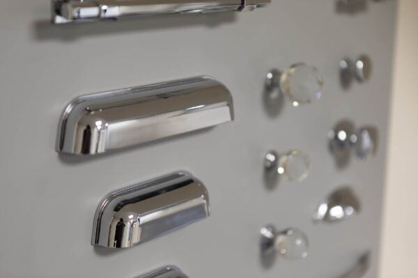 the wall of handle choices available for kitchen doors at the Cavendish Kitchens showroom