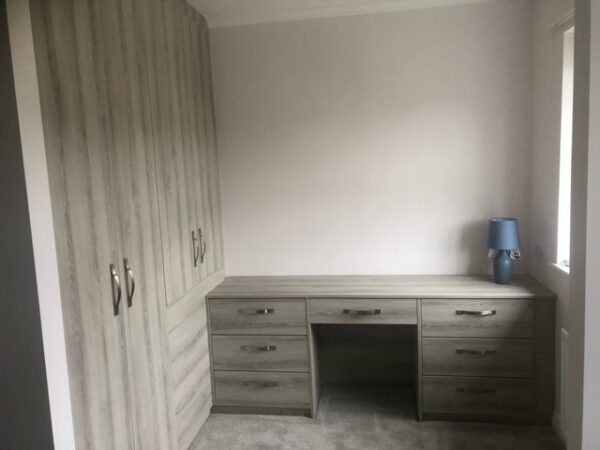 Fitted wardrobe with home office desk in 'Select Tabac Ash' wood style. Installed by Cavendish Kitchens, Newcastle 